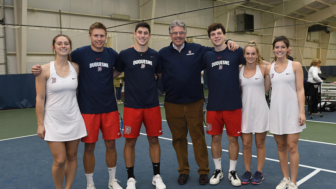 President Gormley with Duquesne tennis players