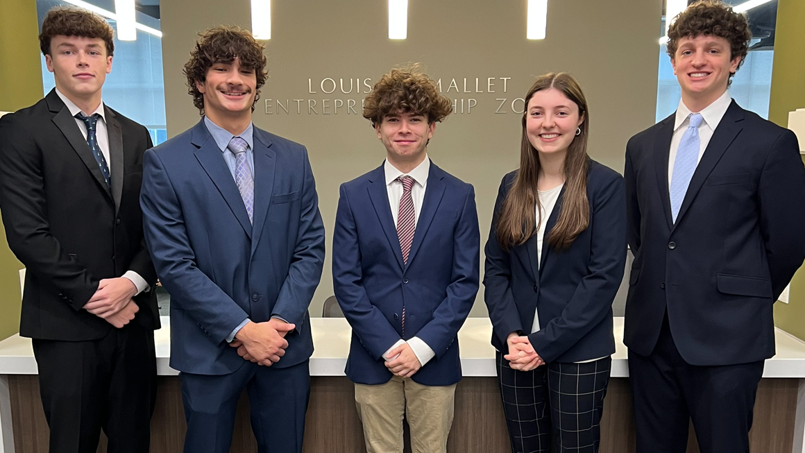 Congratulations to the Fall 2024 winning team, left to right, AJ Kolaris, Jared Kazmierski, Eli Kyle, Nicole Lamberson, and Julian Hargis who designed a smart AI guide that elevates the Gen Z new hire experience.