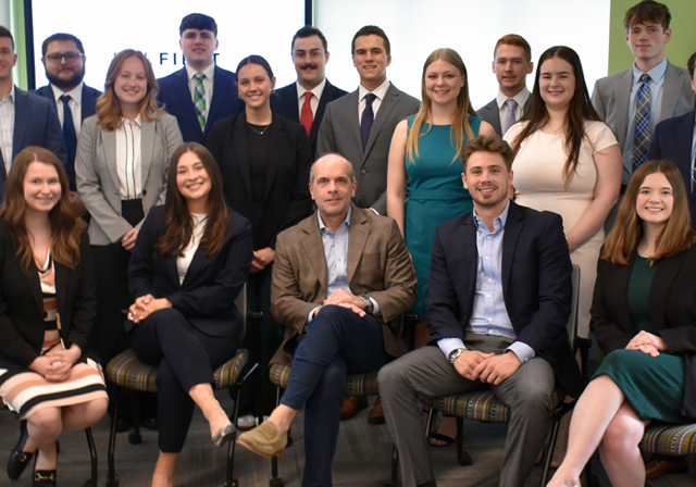 Strategic Management Spring class with Dan Sullivan (center) after final presentations.