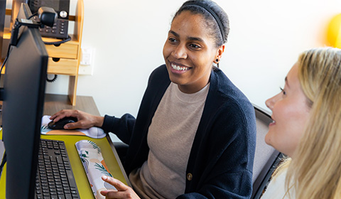 Success Coach Jasmine Jones-Reed (left) assisting a student.