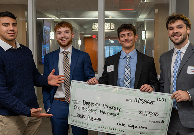 Duquesne Students with check