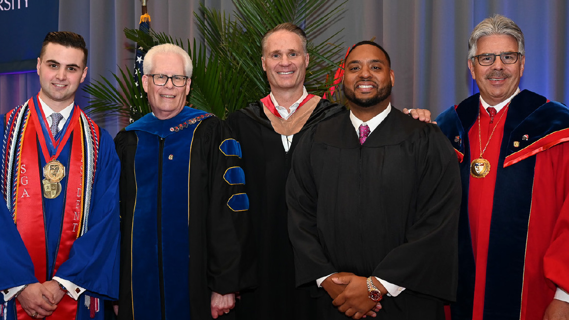 Pictured Left to Right: Claudio Simione, Dr. Dean McFarlin, Jack Glover, Aaron Reed, President Ken Gormley 