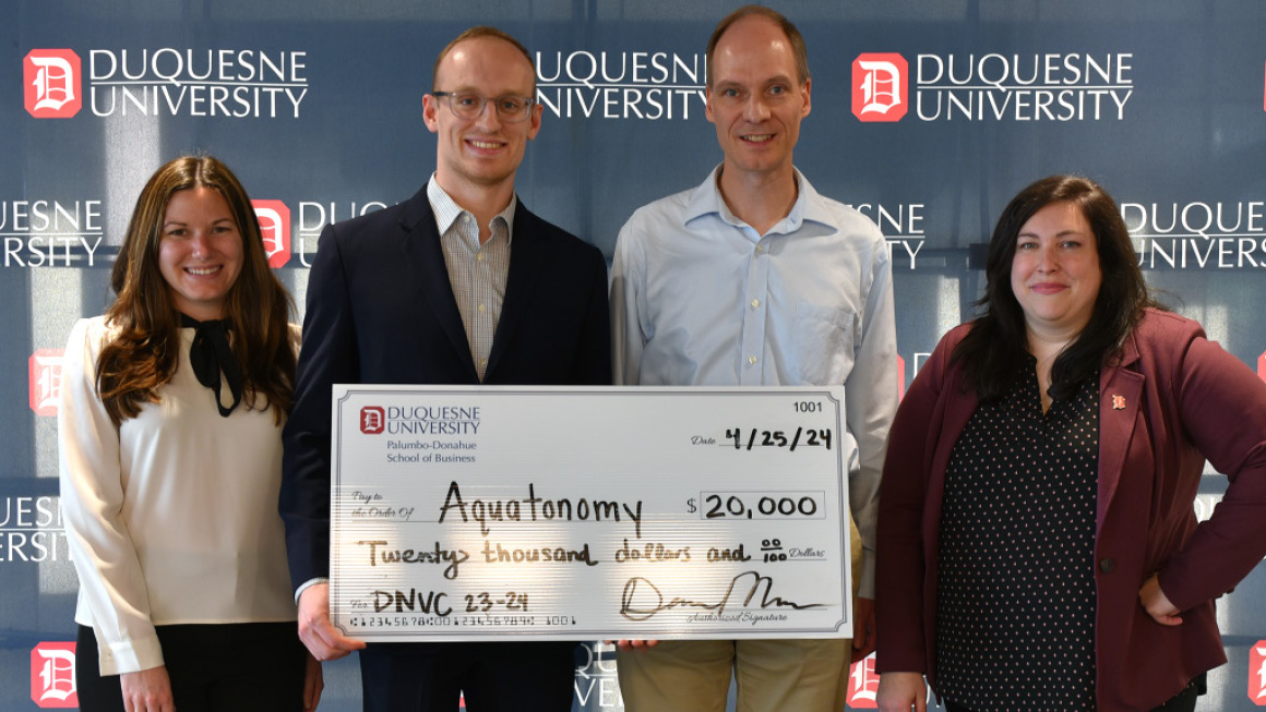 Left to Right: Jane Joseph (B’12), Taylor Pool,  Dr. Michael Kaess, and Duquesne’s Staci Offutt