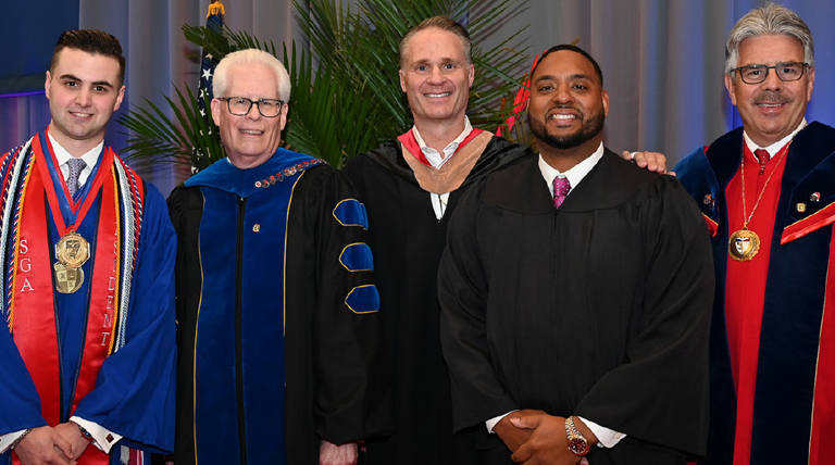 Left to right: Claudio Siminone, Dr. Dean McFarlin, Jack Glover, Aaron Reed, President Ken Gormley