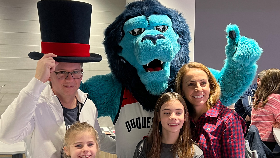 Jared, his daughters, and wife, Holly, celebrate a win with the Duke!