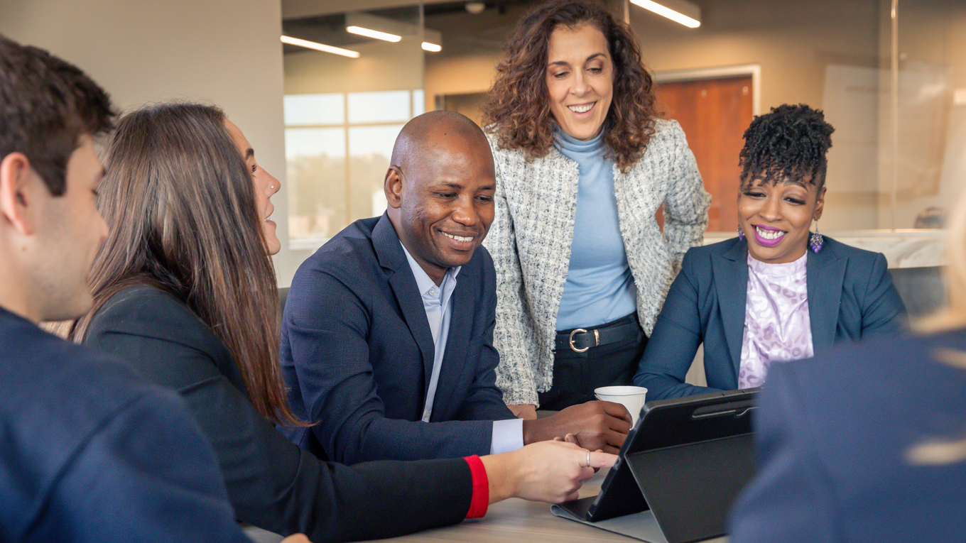 Graduate students work closely with a professor.