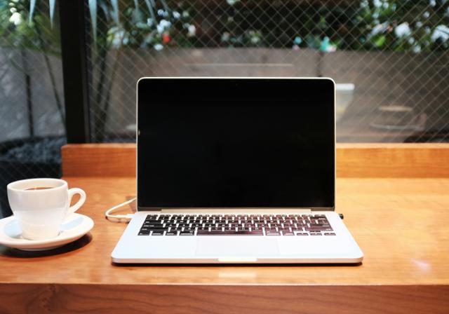 Laptop and coffee mug sitting on a table