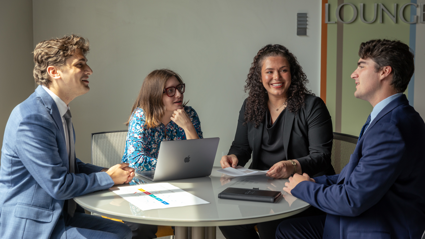 Graduate students collaborate in a lounge.
