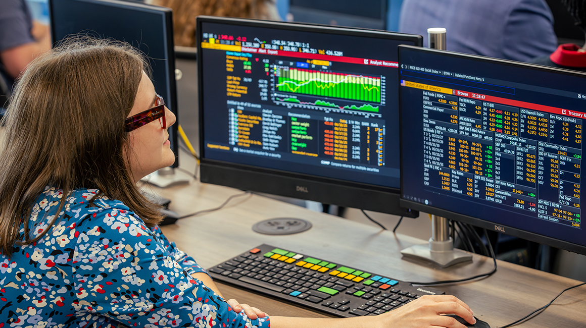 A Duquesne student working at a Bloomberg Terminal.