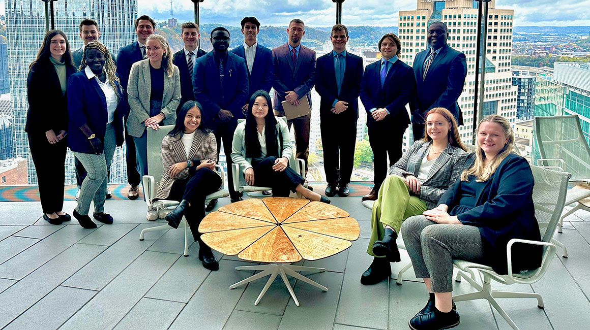 The 2023 One-Year MBA cohort poses for a photo durin a trip to the PNC Tower. 