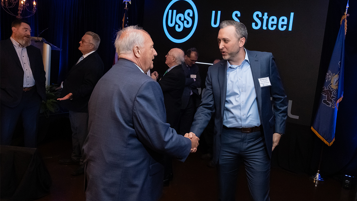 Kevin Lewis shaking hands at a U.S. Steel event