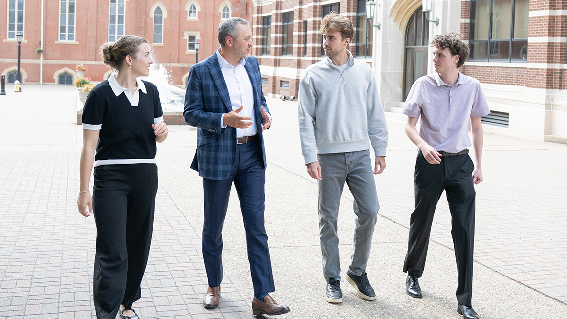 Kevin Lewis meeting with MBA students to discuss career goals