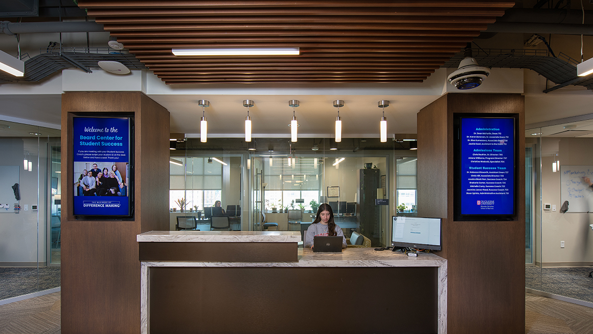A student studying in the Eugene P. Beard Center for Student Success.