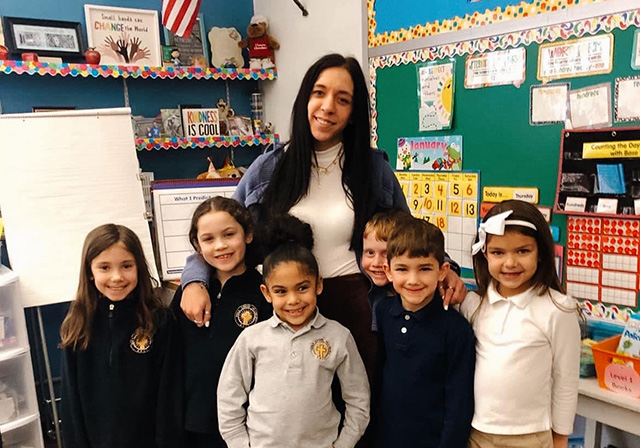 School of Education student Caterina Veneziano with young children in the classroom