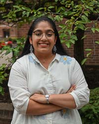 Middle Level student Hetanshi Shah Outside on Campus Smiling