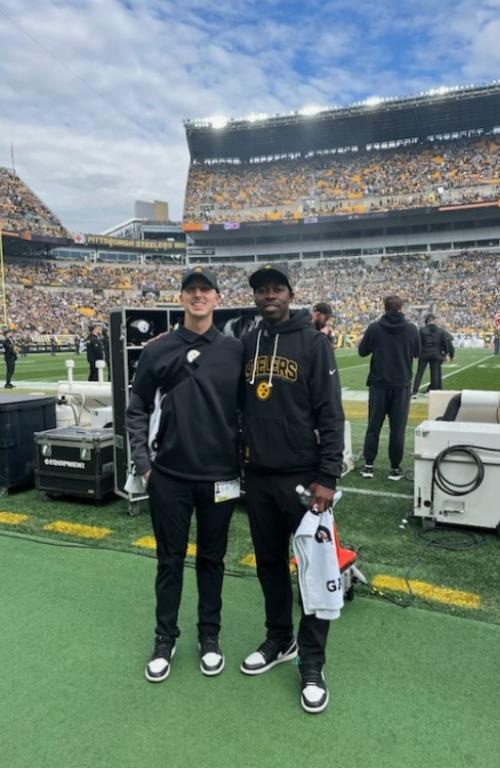 Casey Padgett with Steelers staffer at Acrisure Stadium.