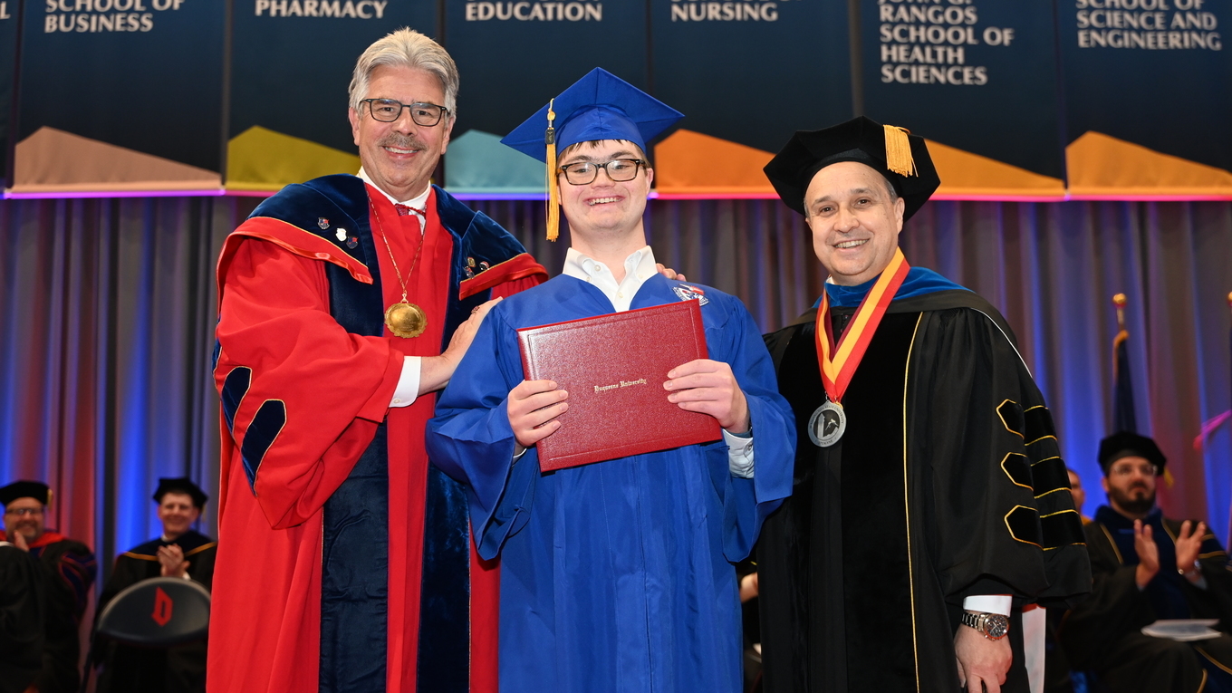 Compass Student Graduating