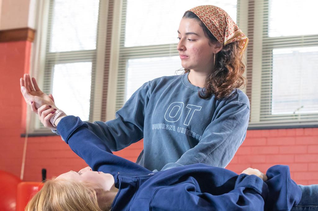 health sciences ot student with patient