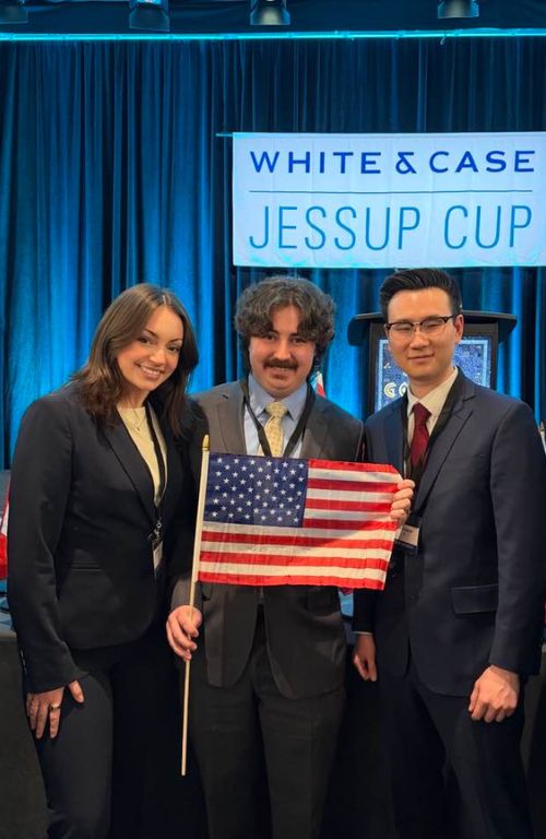 Jessup team holding american flag