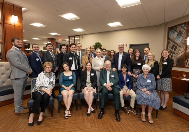 President Gormley, Dean Barton, and Jack McGinley with law students and alumni selected McGinley Fellows. 