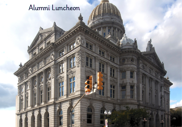 The Westmoreland County Courthouse, a large white stone structure.  A streetlight and trees are in the foreground.  The words Alumni Lunch appear.