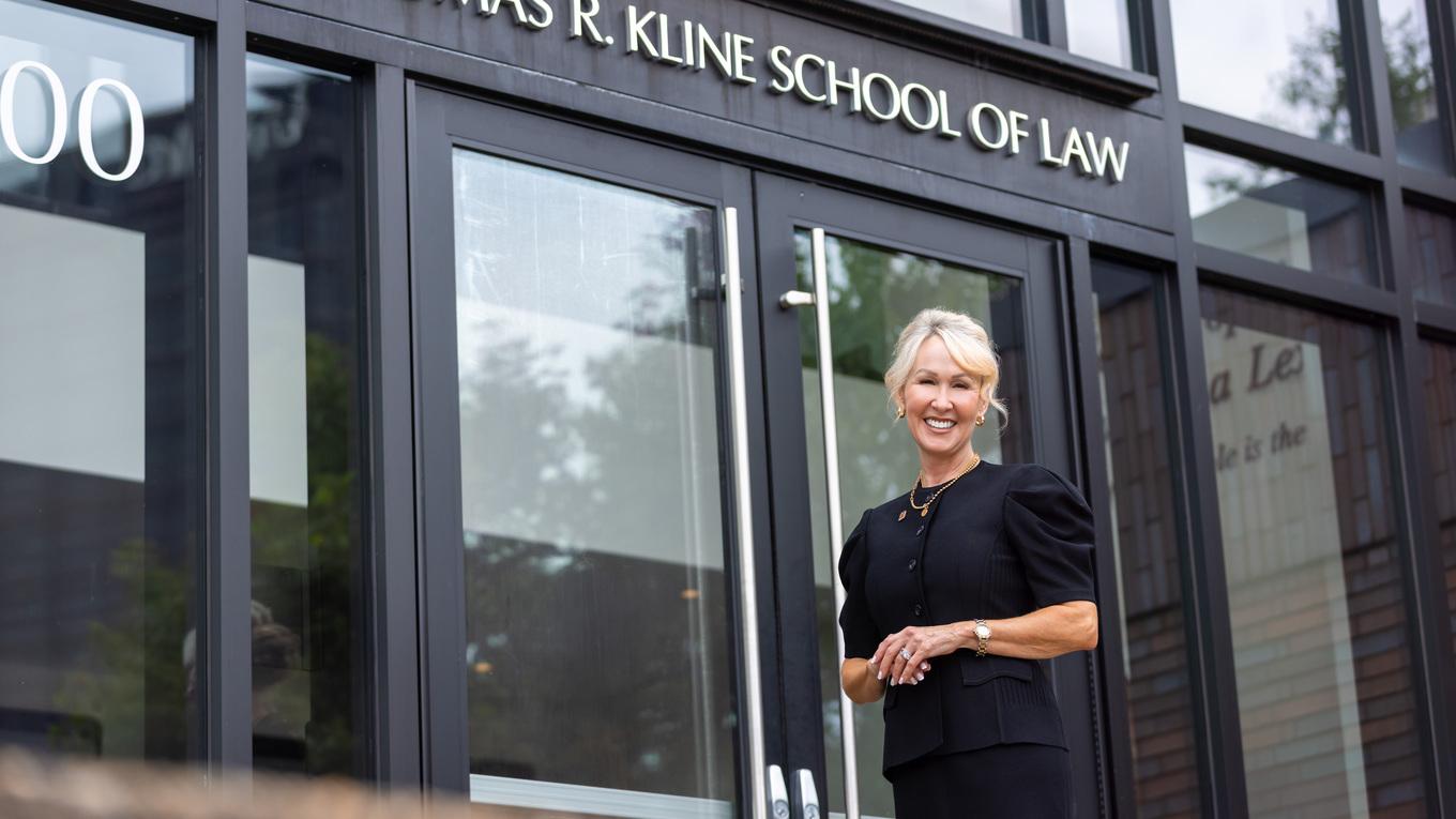 Dean April Barton in front of law school