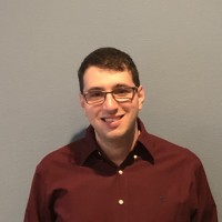 Extern Jake Salzer in red dress shirt
