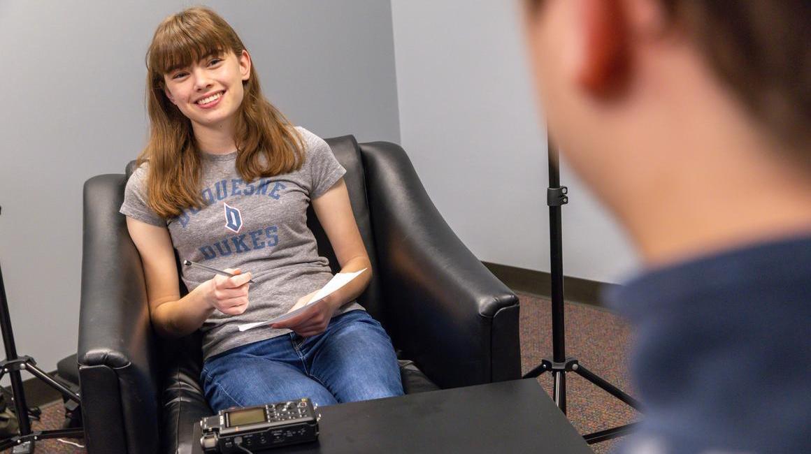 Student interviewing research participant in Digital History Lab