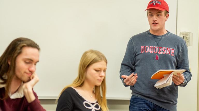 Students participating in a debate. 