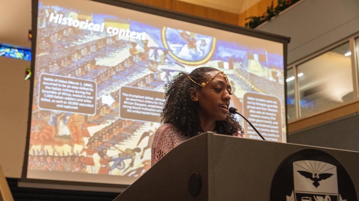 Student gives speech during intercultural lecture.