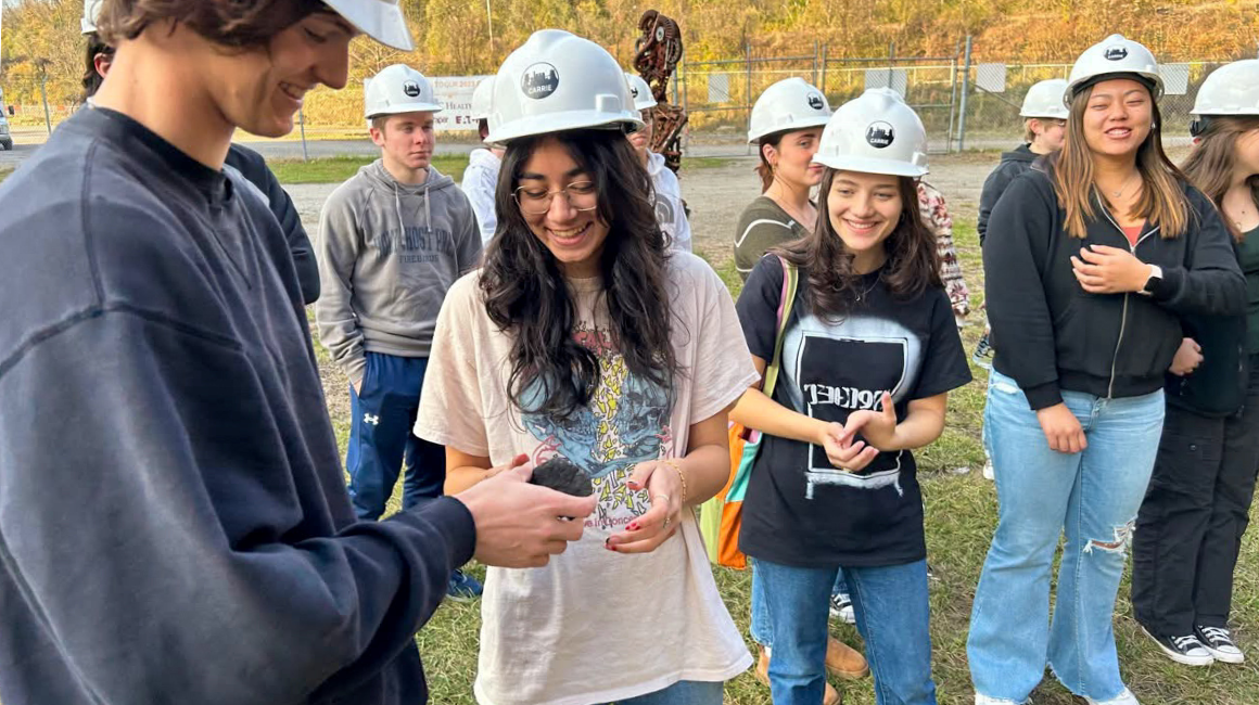 Students inspect mineral during Rivers of Steel field trip.
