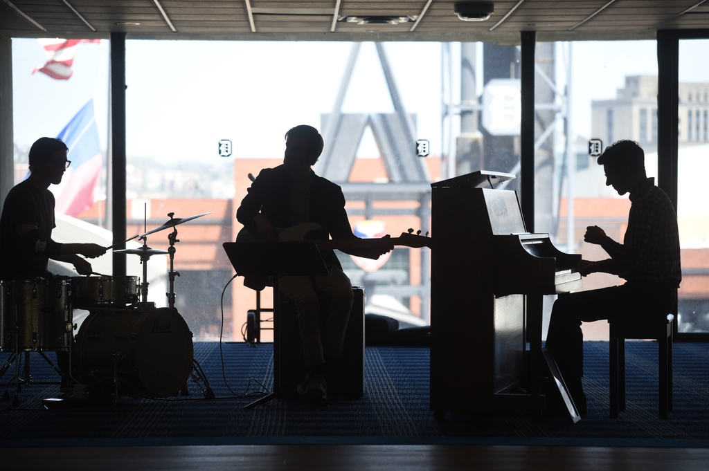 Duquesne music students in the shadow by a window