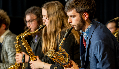 Saxophonists performing.