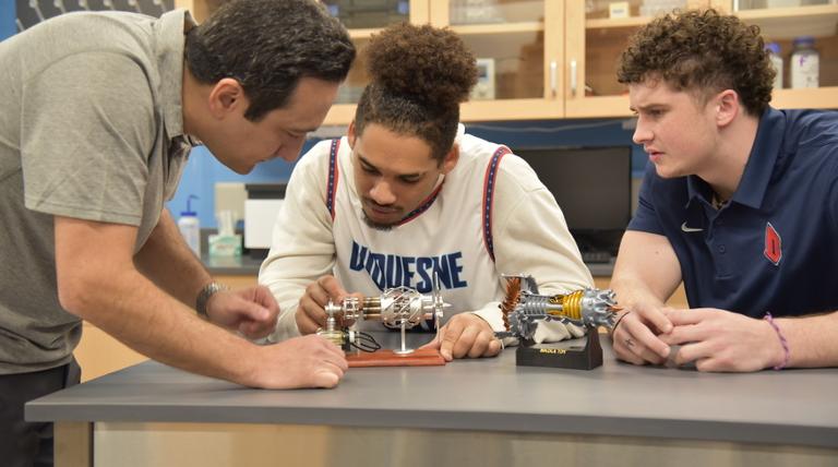 three people conducting research