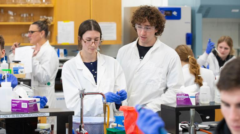 people looking at equipment