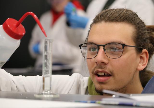 girls holding molecules