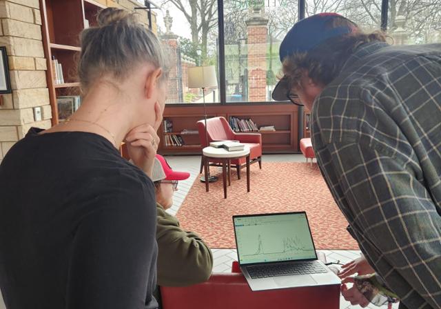 people looking at a computer