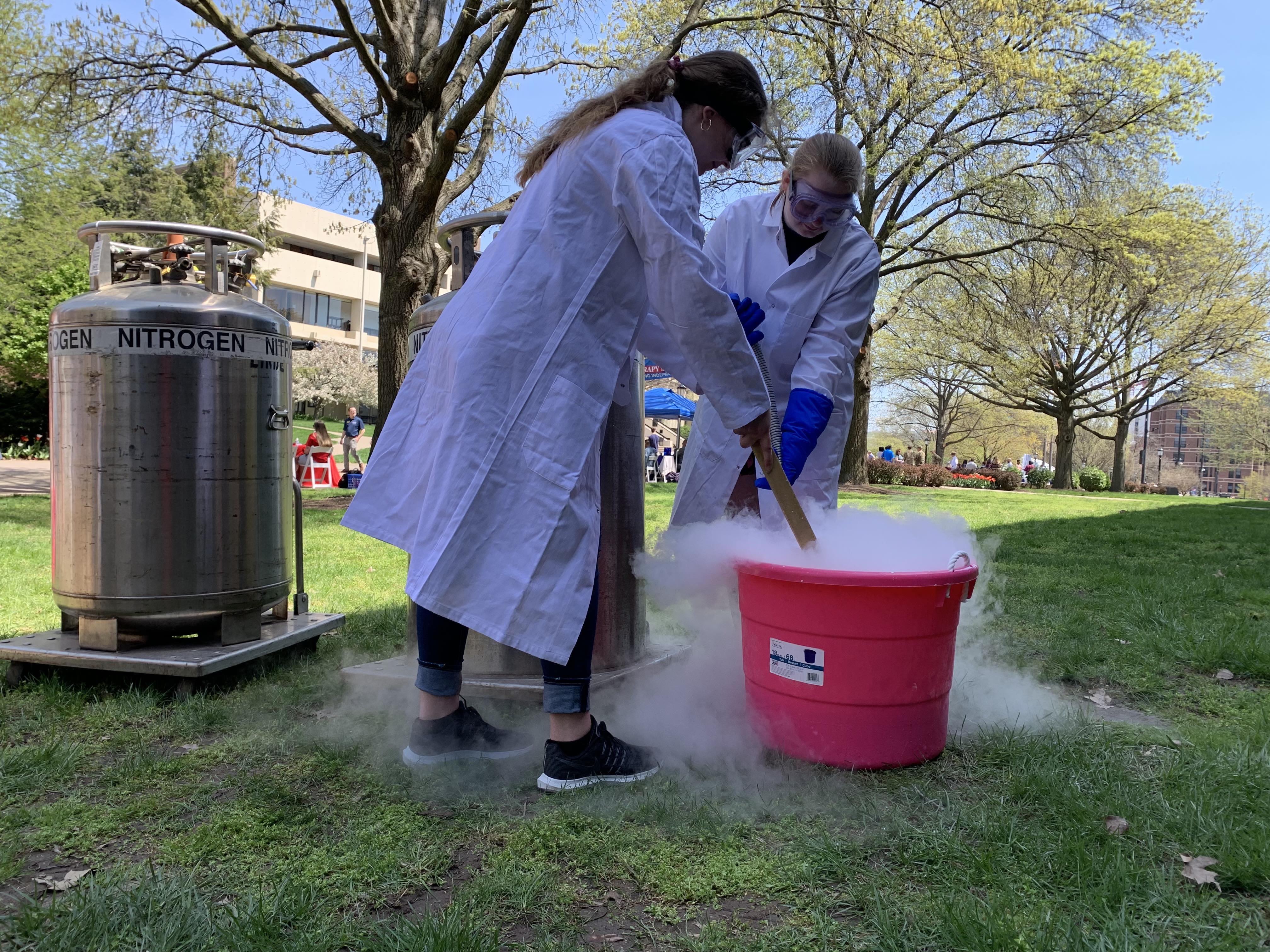 two people making liquid nitrogen ice cream