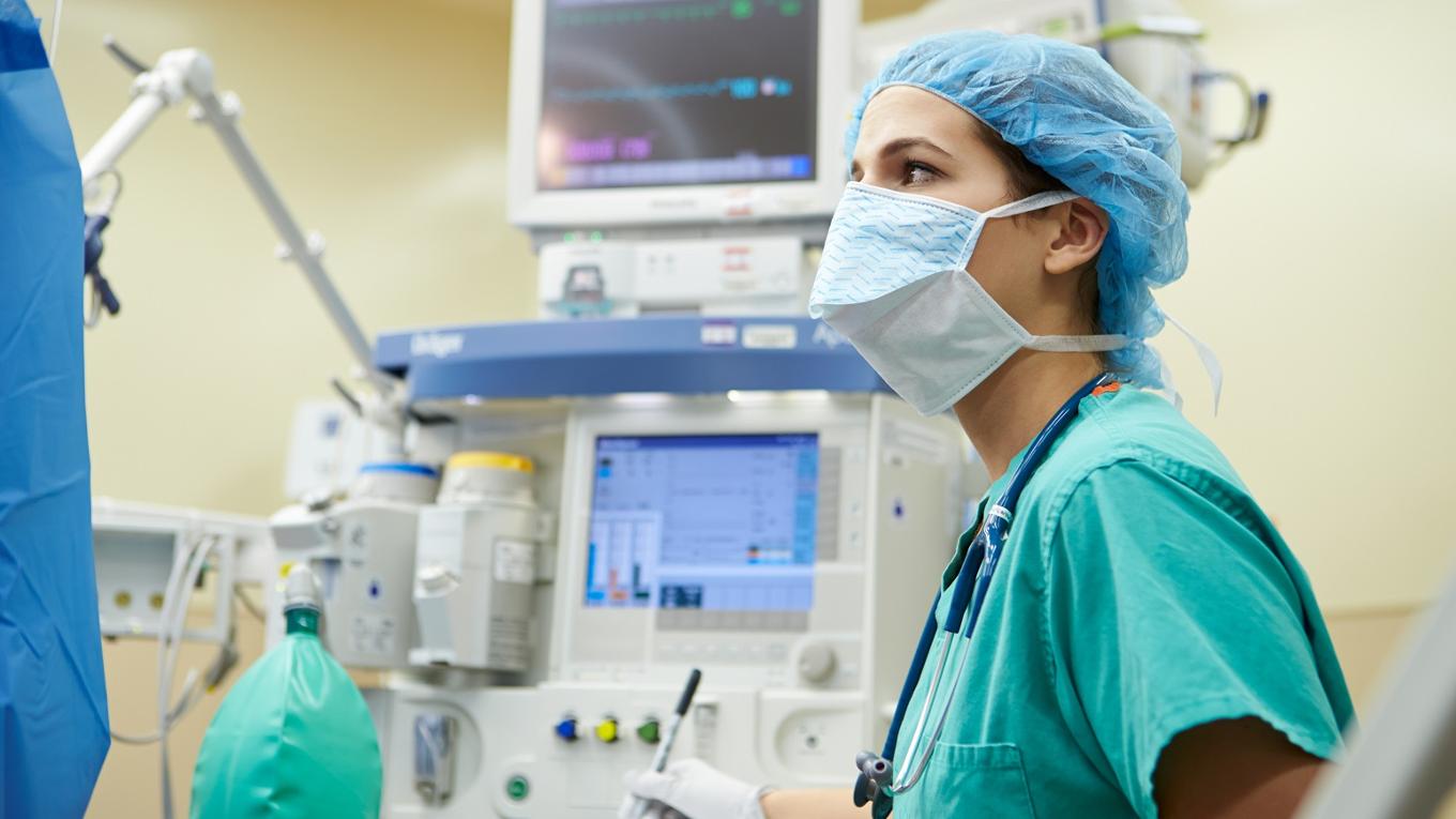 A nurse works in an operating room. 