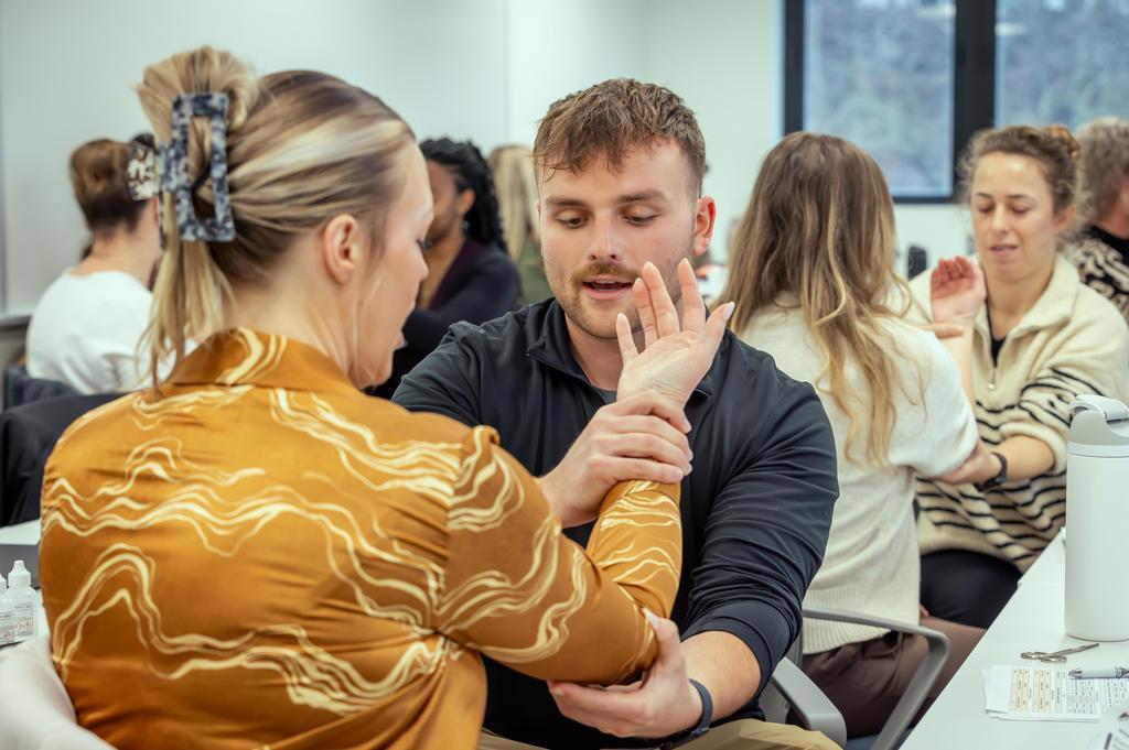 Two nursing students in class.