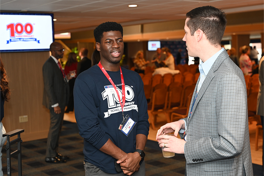 student with alumnus at centennial