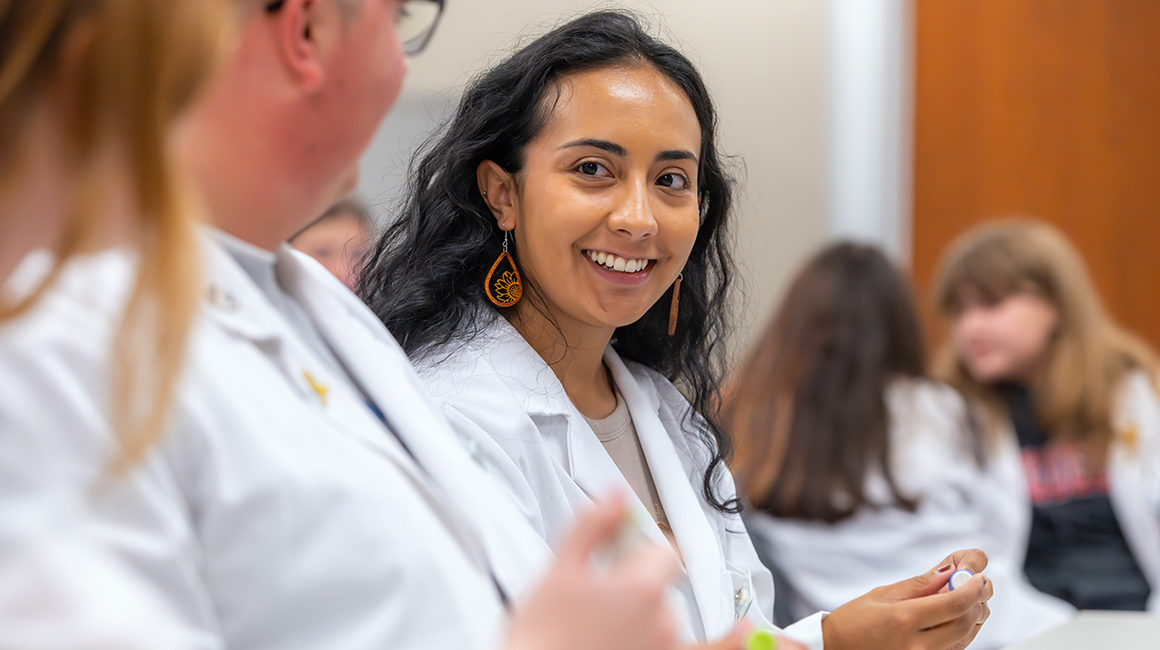 pharmacy students collaborating in a lab setting