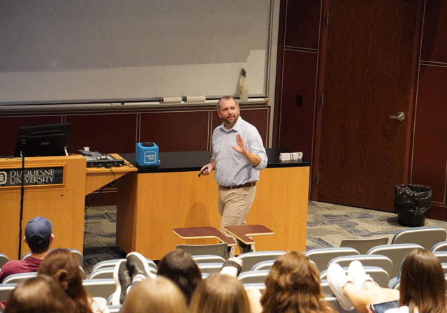 professor teaching in classroom with students