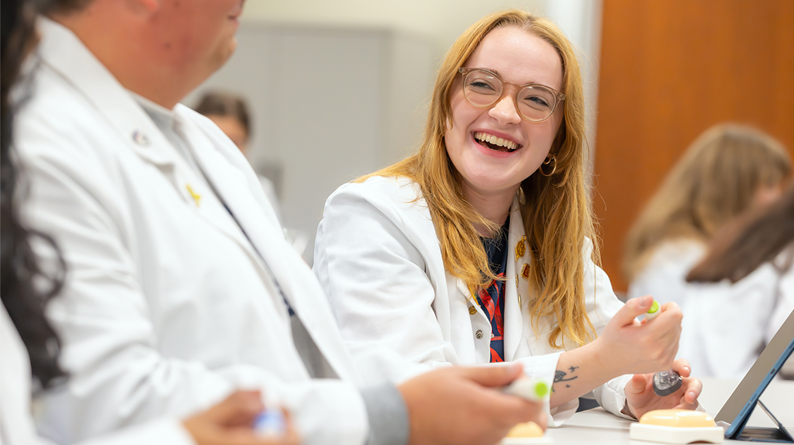 pharmacy students collaborating in a lab setting
