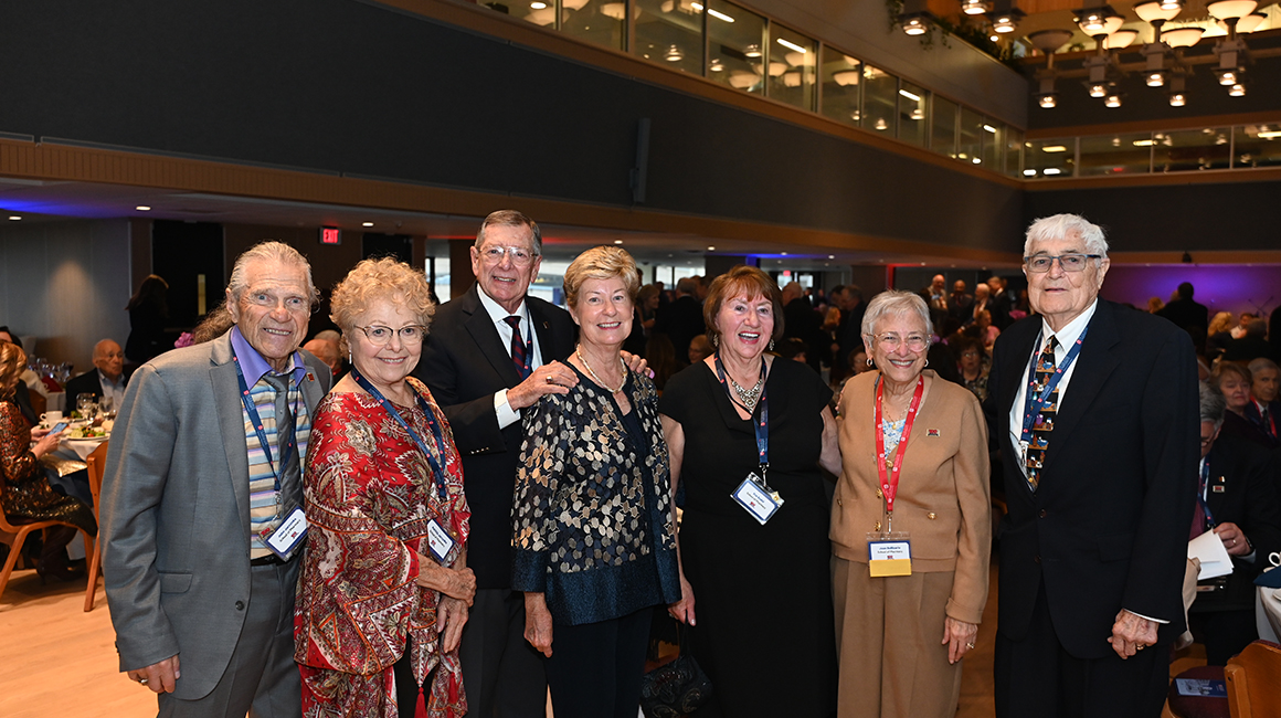 alumni in a photo at centennial gala