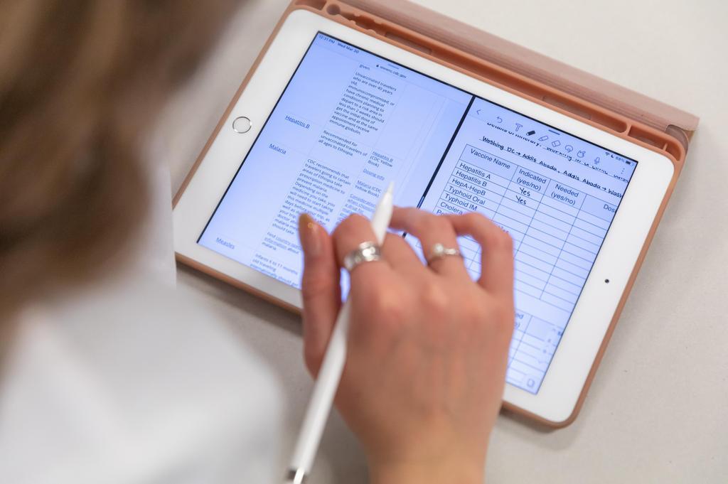 Student on a tablet learning pharmacy online