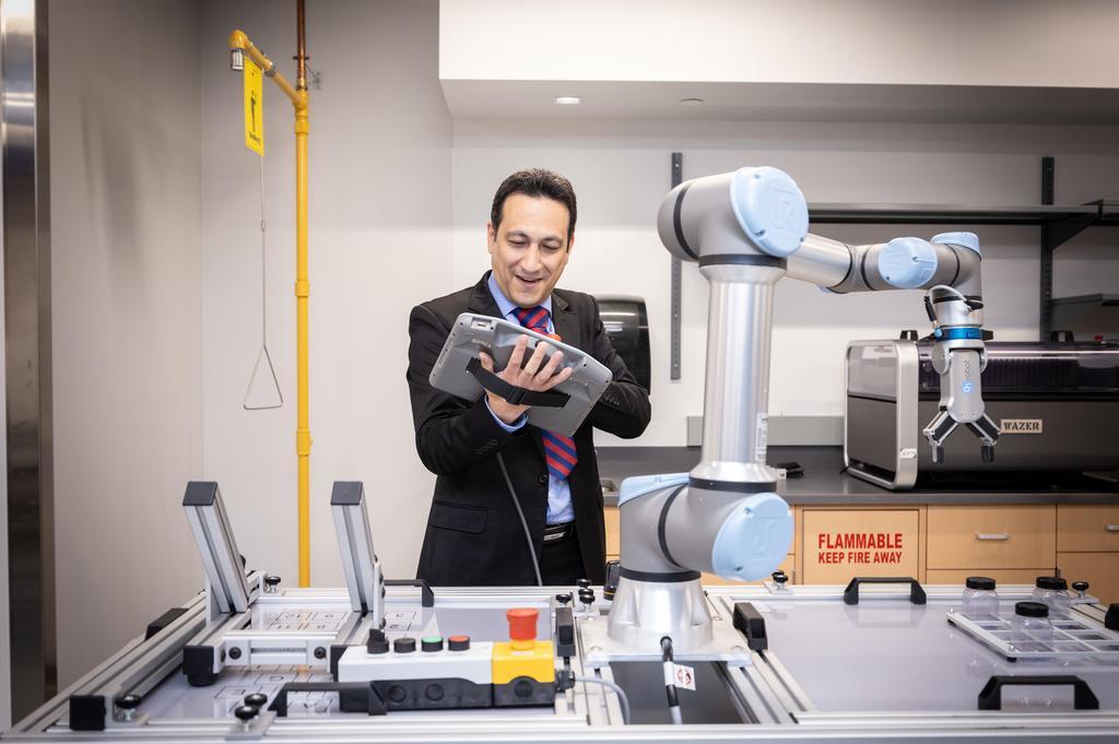 a male looking at a computer