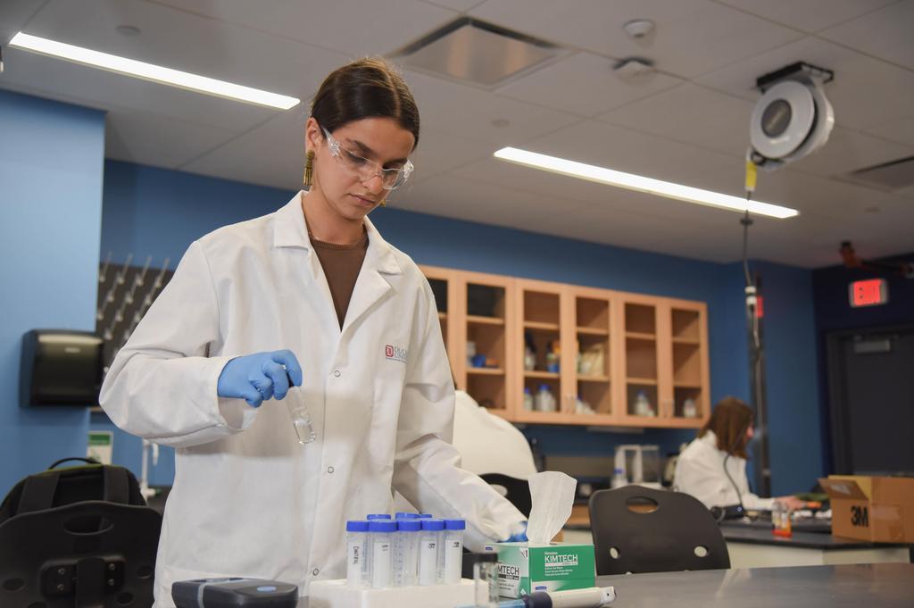 girl using a beaker 