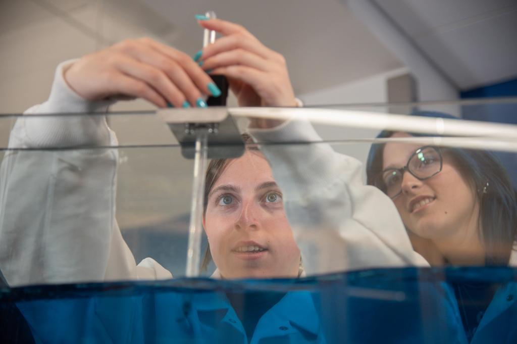 two girls at a water table