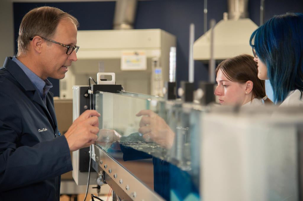 student working at the river table
